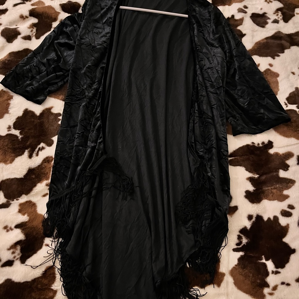 A nice cardigan sweater nice for a night out never worn it